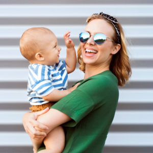 mom and baby smiling